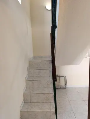 a set of stairs in a room with at Casa Gomez C in Albufeira