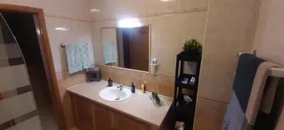 a bathroom with a sink and a mirror at Villa David in Albufeira
