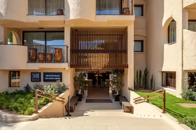 an external view of a building with a walkway at 3HB Falesia Beach in Albufeira