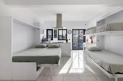 two beds in a room with white walls at Mi Casa Es Su Casa Nº3 in Albufeira