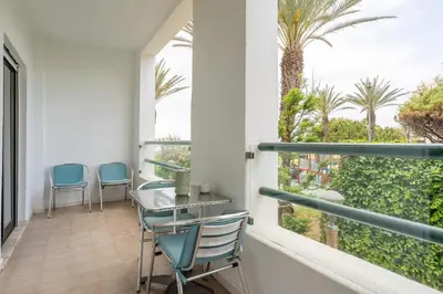 a kitchen with a counter top and a sink at Cartaia Apartamento Leste in Quarteira