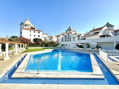 a swimming pool in front of a building at Vilamoura Central 12 With Pool by Homing in Vilamoura