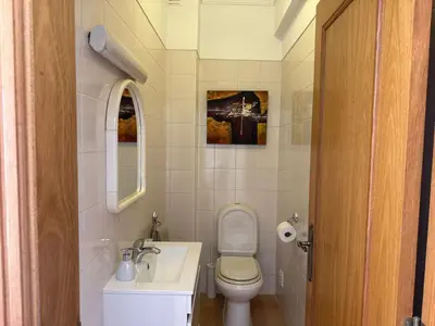 a small bathroom with a toilet and a sink at Townhouse Sol&Mar Vilamoura in Vilamoura