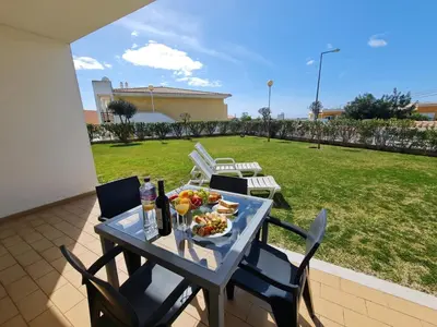 a table with food and drinks on a patio at Encosta Sao Jose - Apartment BF in Albufeira
