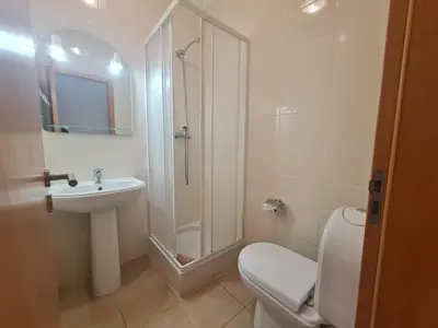 a bathroom with a toilet and a sink and a shower at Encosta Sao Jose - Apartment BF in Albufeira