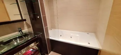 a bathroom with a glass sink and a mirror at Sossego a Sul in Albufeira