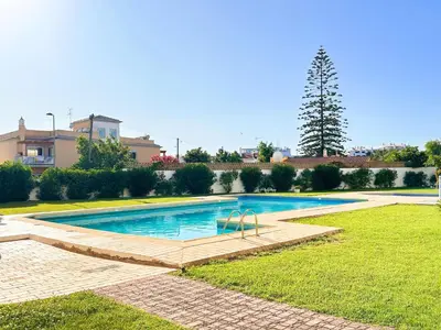 a swimming pool in the yard of a house at Oura Modern Poolside Condo by BeCherish in Vale de Pedras