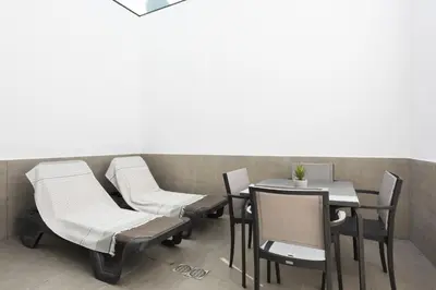 a row of chairs and a table in a restaurant at Castilhos 1 - City center by HD in Faro