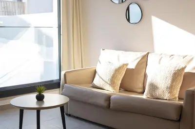 a living room with a couch and a table at Castilhos 2 - City center by HD in Faro