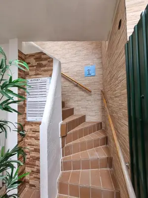 a staircase in a building with a sign on it at By the Sea Apartments B3 in Albufeira
