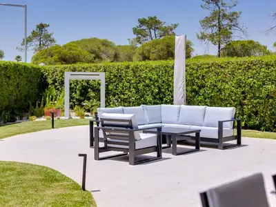 a bedroom with a bed and a large window at Casa Barakat with Pool and BBQ in Vale do Lobo in Quinta do Lago