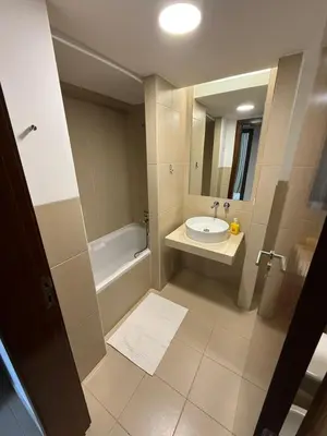 a bathroom with a sink and a tub and a toilet at Herdade dos Salgados in Guia