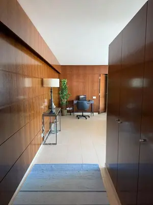 a hallway with a desk and a chair in a building at Herdade dos Salgados in Guia