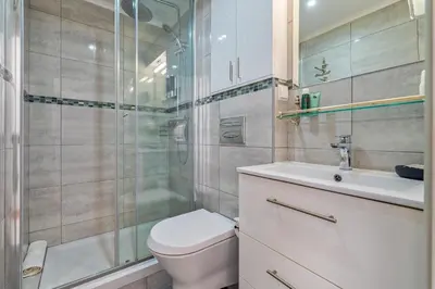 a bathroom with a toilet and a shower and a sink at Prestige Flat by Albufeira Holidays in Albufeira
