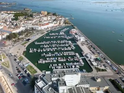 an aerial view of a marina with boats in the water at Faro Charm Apartment - City Center in Faro