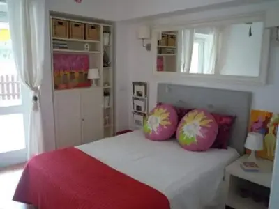 a bedroom with a bed with two pillows on it at Charming House in Albufeira with Shared Pool in Albufeira