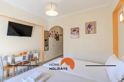 a room with a bed and a dining room at #324 Ribeira Park by Home Holidays in Albufeira