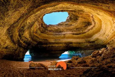 a rock cave with a hole in the water at #324 Ribeira Park by Home Holidays in Albufeira