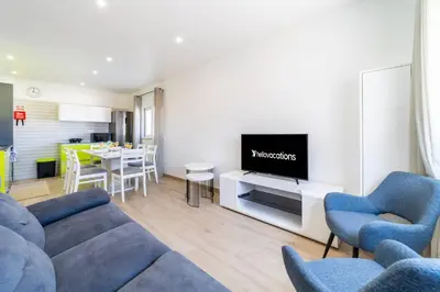 a living room with a couch and a tv at Golden View Villa by HelloVacations in Albufeira
