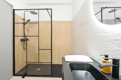 a bathroom with a shower and a sink at Sea Side in Albufeira