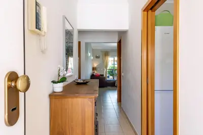 a kitchen with a wooden counter and a refrigerator at Encosta Sao Jose - Apartment V in Albufeira