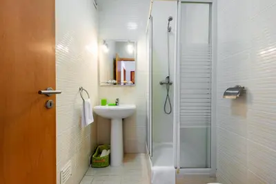 a bathroom with a sink and a shower at Encosta Sao Jose - Apartment V in Albufeira