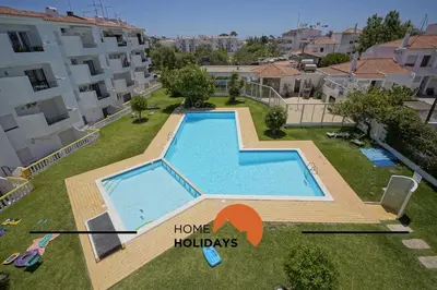 a bedroom apartment with a swimming pool at #295 Beco do Sol 29A by Home Holidays in Albufeira
