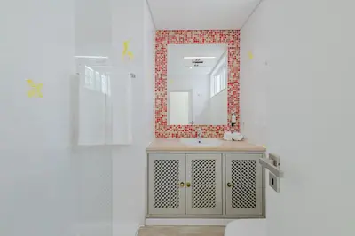 a bathroom with a sink and a mirror at The 23 Suites in Faro
