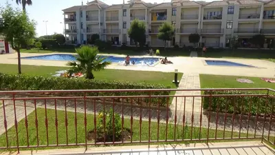 a building with a swimming pool in front of a building at Beach Apartment Vilamoura Villa Columbus in Vilamoura