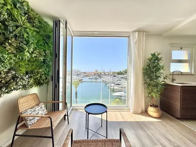 a living room with a view of a marina at Vilamoura Marina View 4 by Homing in Vilamoura