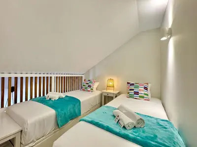 two beds with towels on them in a room at Vilamoura Marina View 4 by Homing in Vilamoura