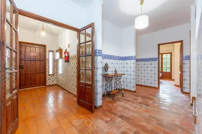 a bedroom with a bed and a large window at Casa Gralheira - Private Pool & Sea View in Albufeira