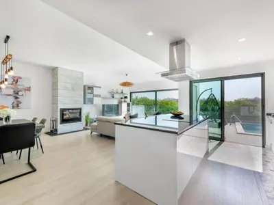 a kitchen and living room with white walls and a counter top at Villa Linda V3 Lote 67 - VIP Properties by Interhome in Albufeira
