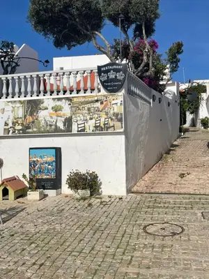 a white wall with a sign on it at Casa Tapada do Bento III- Albufeira in Albufeira