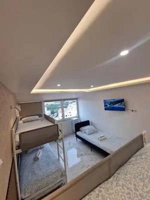 a bathroom with a sink and a mirror at LuxPool Albufeira Stay in Albufeira