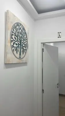 a painting hanging on a wall next to a door at Casa Tapada do Bento II- Albufeira in Albufeira