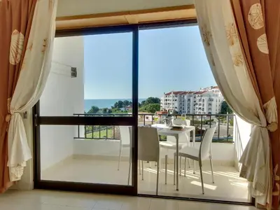 a view of a balcony with a table and chairs at Atlantic Horizon by Seareen in Albufeira