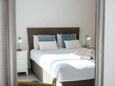 a mirror reflection of a bed in a bedroom at Vitismar Apartment by Stay ici Algarve Holiday Rental in Guia