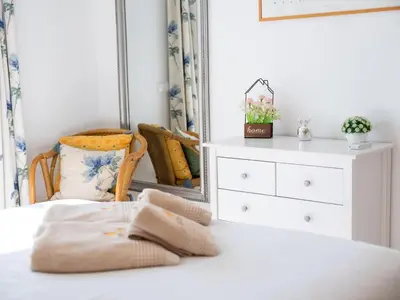a bedroom with a dresser and a mirror at Vitismar Apartment by Stay ici Algarve Holiday Rental in Guia