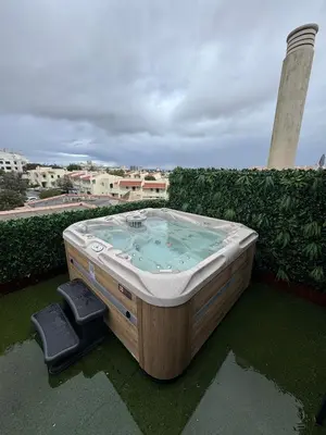 a hot tub sitting on top of a roof at Apartamento Perfeito in Albufeira