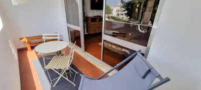 a view of a room with a table and chairs at Appartement Touristique dans une résidence Hôtelière Silchoro in Albufeira
