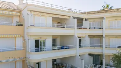 a building with balconies on the side of it at Greice Homes - T2 - JV - Vilamoura Centre in Quarteira