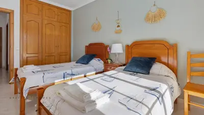 two beds sitting next to each other in a room at Greice Homes - T2 - JV - Vilamoura Centre in Quarteira
