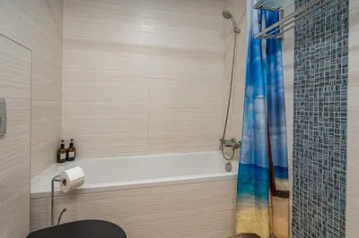 a bathroom with a tub and a shower at Casa Vista Brejos in Albufeira