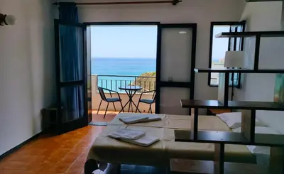 a room with a bed and a view of the ocean at Sea Paradise in Albufeira