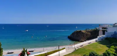 a view of a beach with people in the water at Sea Paradise in Albufeira