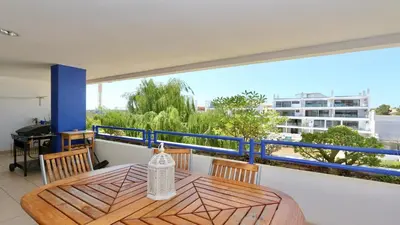 a table and chairs on a balcony with a view at Mediterraneo 2ºB - CD 318, Cleverdetails - sleeps 2 adults and 1 child in Vilamoura