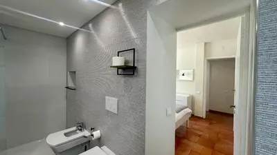 a bathroom with a sink and a toilet in it at Tropicana by Check-in Portugal in Albufeira
