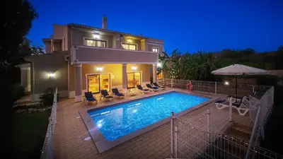 a swimming pool in front of a villa at Atanasio by Check-in Portugal in Albufeira
