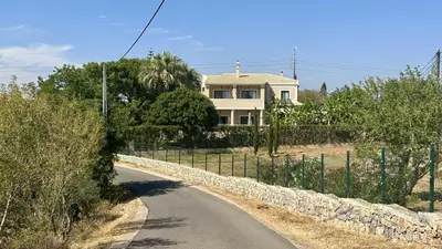 a road leading to a white house with a fence at Atanasio by Check-in Portugal in Albufeira